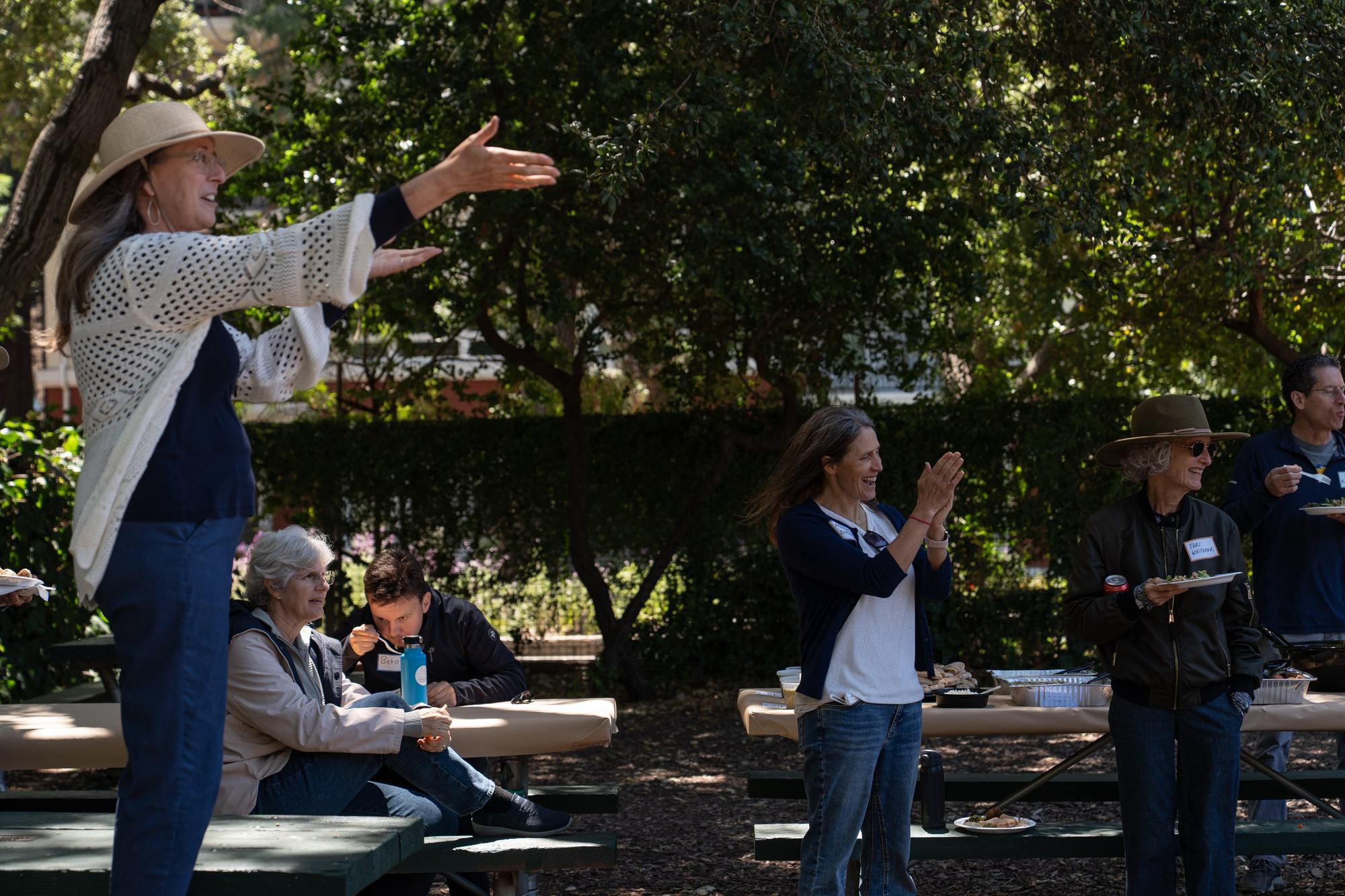 Speaker gesturing to attendees